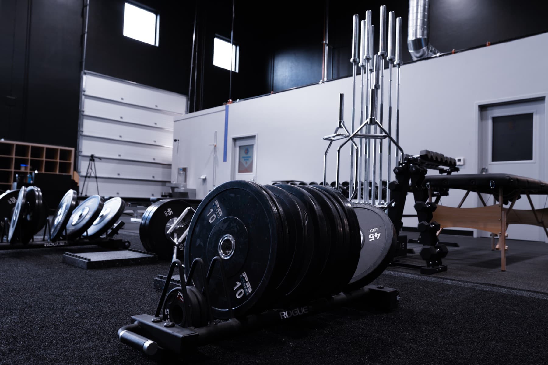 Open training floor with racks and platforms