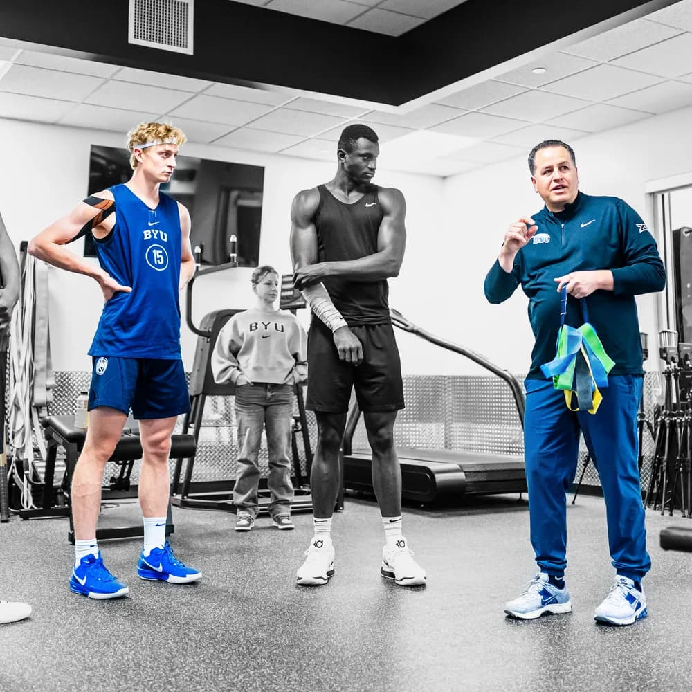 Richie Saunders listening as Mike Davie coaches a team session
